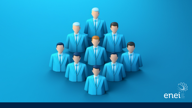 This illustration depicts a group of faceless white men in corporate dress, they are shown waist upwards and stand in a hierarchical triangular formation.